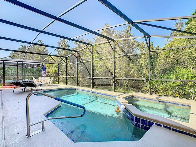 view of pool with a patio, an in ground hot tub, and glass enclosure