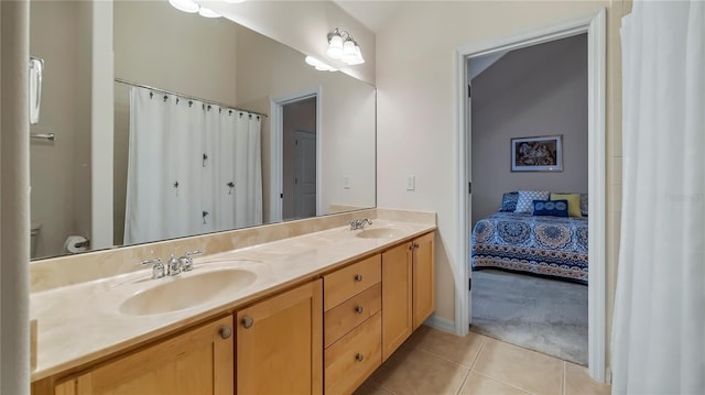 bathroom with vanity, toilet, and tile patterned floors