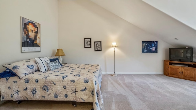 carpeted bedroom featuring lofted ceiling