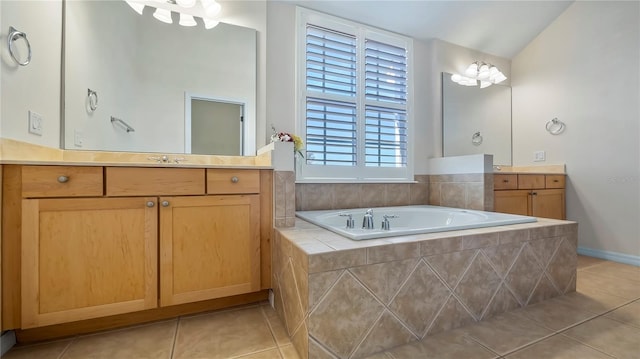 bathroom with vanity, lofted ceiling, tiled bath, and tile patterned floors