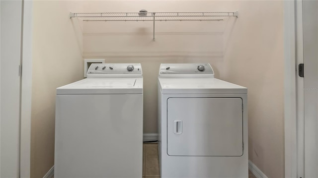 laundry room with separate washer and dryer