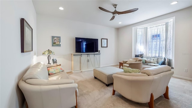 living room with light carpet and ceiling fan