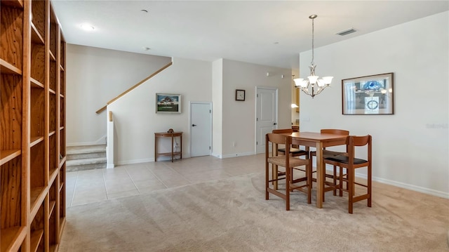 tiled dining space featuring a chandelier