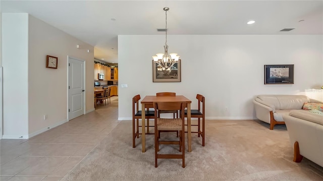 tiled dining area with a chandelier