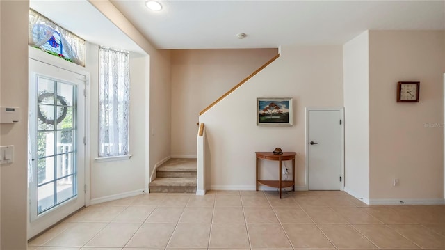 tiled foyer entrance featuring plenty of natural light