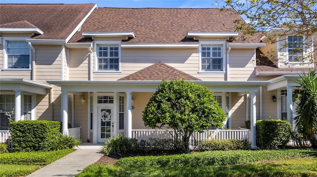 view of property featuring covered porch