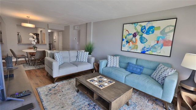 145 N Halifax Ave Unit 711, Daytona Beach, FL 32118 - living room featuring light wood-type flooring