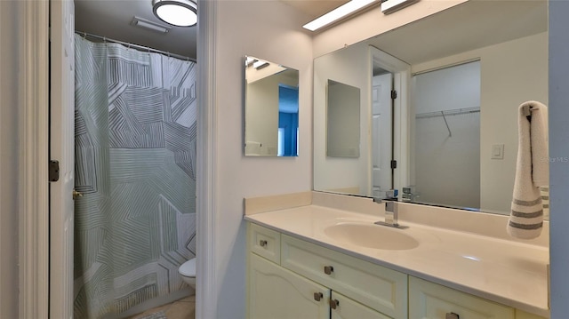 145 N Halifax Ave Unit 711, Daytona Beach, FL 32118 - bathroom with vanity, toilet, and a shower with curtain