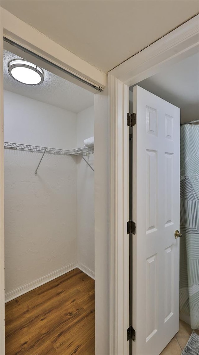 145 N Halifax Ave Unit 711, Daytona Beach, FL 32118 - walk in closet featuring hardwood / wood-style flooring