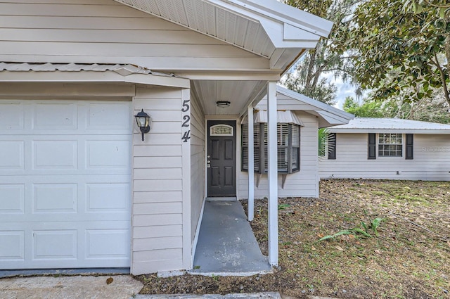 property entrance featuring a garage