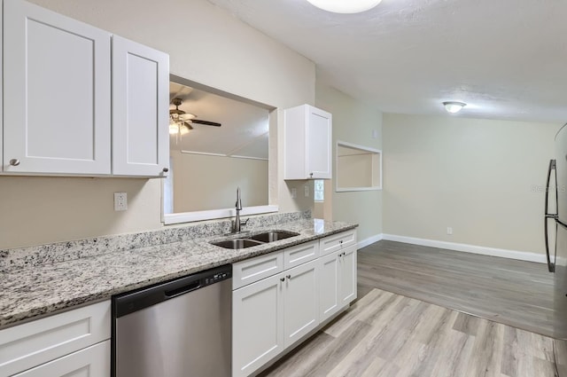 kitchen featuring white cabinets, stainless steel appliances, light hardwood / wood-style floors, and sink