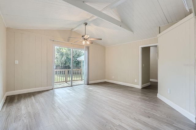 unfurnished room with wood walls, ceiling fan, wood ceiling, light hardwood / wood-style flooring, and vaulted ceiling with beams