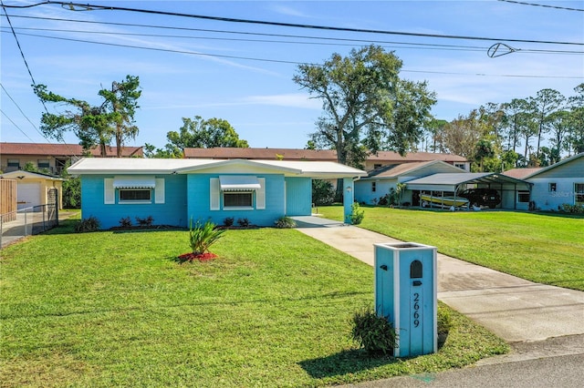 ranch-style house with a front lawn and a carport