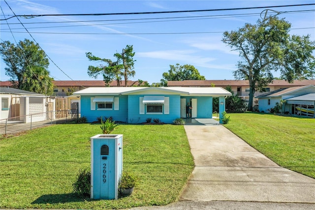 ranch-style house with a front lawn