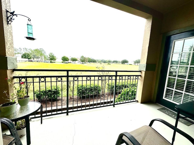 balcony featuring a rural view