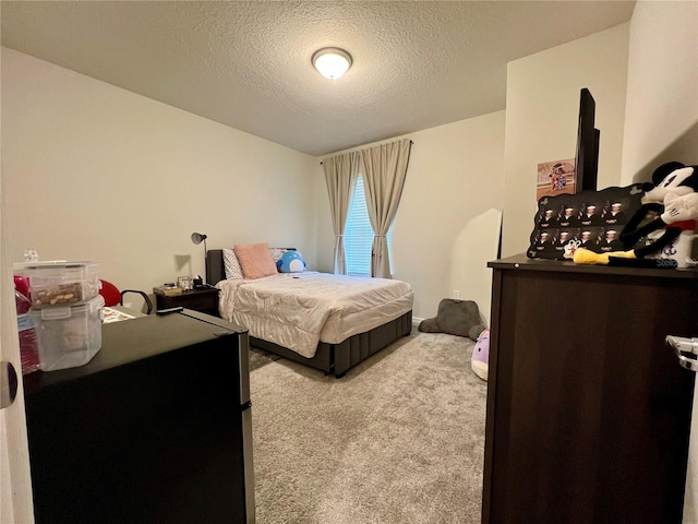 carpeted bedroom with a textured ceiling