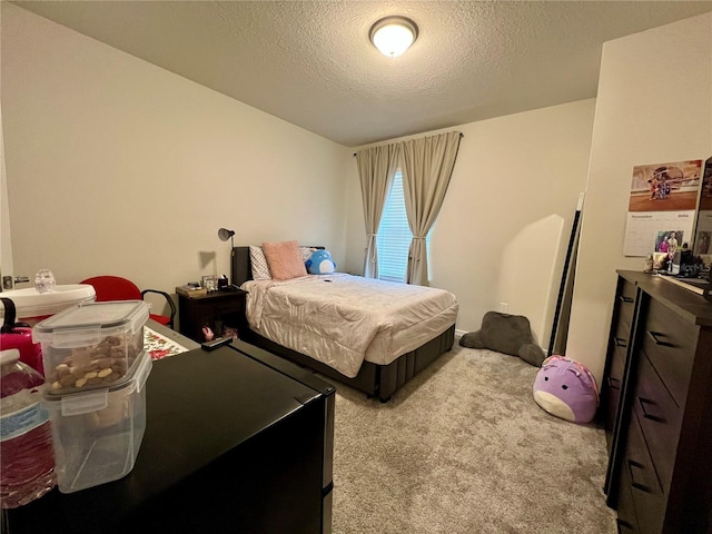 carpeted bedroom with a textured ceiling