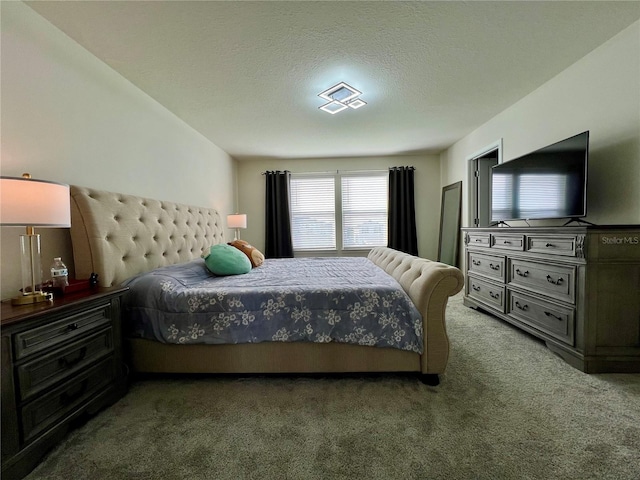 carpeted bedroom featuring a textured ceiling