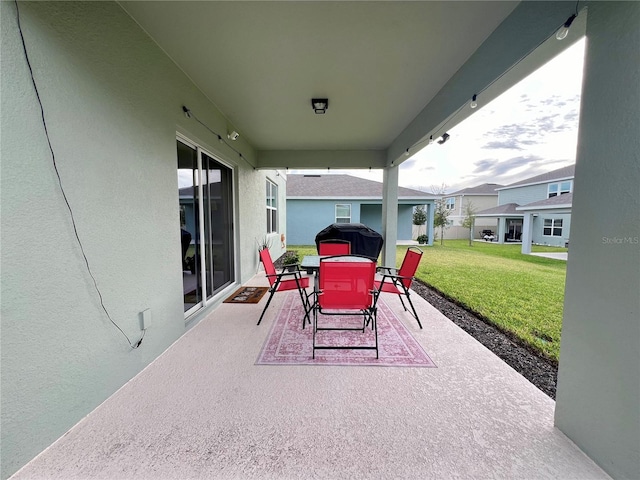 view of patio / terrace with a grill and outdoor dining space