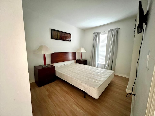 2878 Club Cortile Cir Unit A, Kissimmee, FL 34746 - bedroom with baseboards and wood finished floors