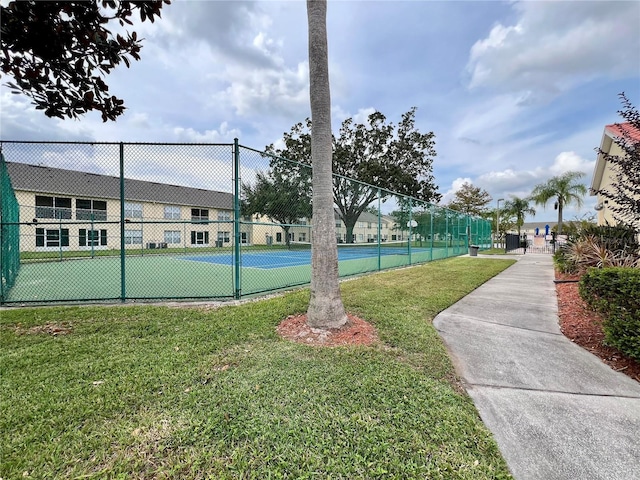 2878 Club Cortile Cir Unit A, Kissimmee, FL 34746 - view of tennis court with a lawn and fence