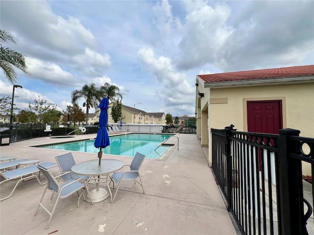 2878 Club Cortile Cir Unit A, Kissimmee, FL 34746 - community pool with a patio and fence