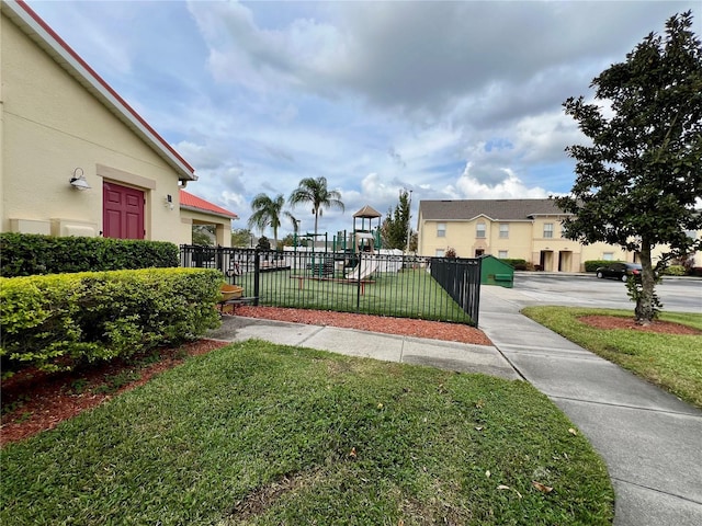 2878 Club Cortile Cir Unit A, Kissimmee, FL 34746 - view of yard with fence and playground community