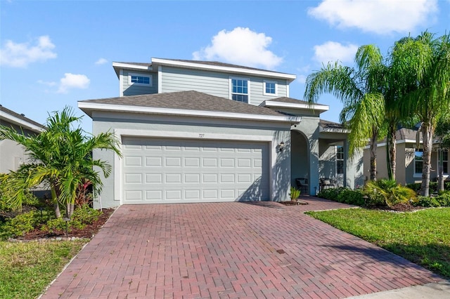 view of front of property featuring a garage