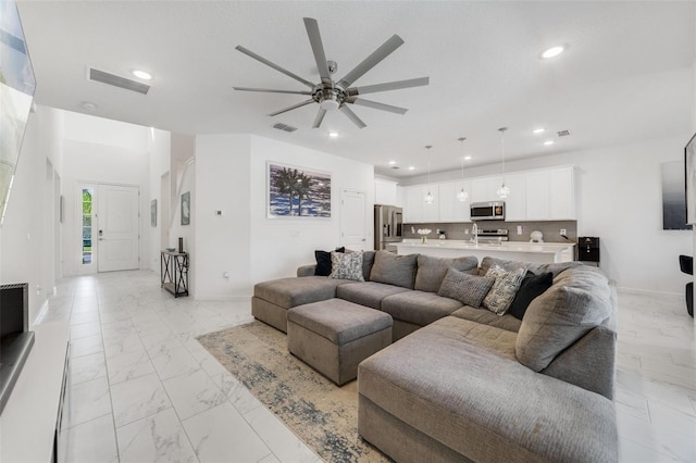 living room with ceiling fan