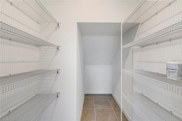 walk in closet featuring light tile patterned floors