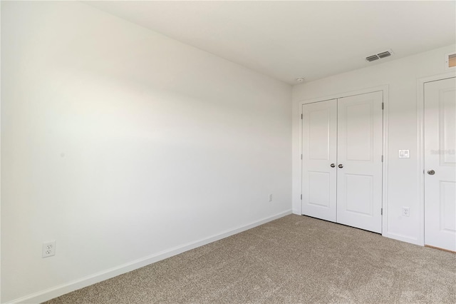 unfurnished bedroom featuring carpet