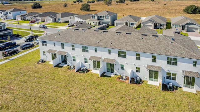 back of house featuring a yard