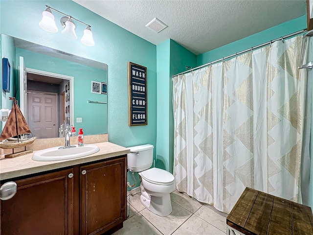 bathroom with curtained shower, a textured ceiling, toilet, vanity, and tile patterned flooring