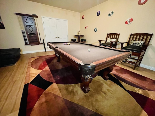 recreation room with hardwood / wood-style flooring and pool table