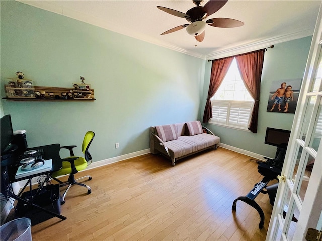 office featuring ceiling fan, light hardwood / wood-style flooring, and ornamental molding