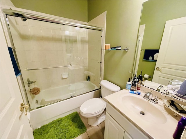 full bathroom with tile patterned flooring, vanity, toilet, and enclosed tub / shower combo