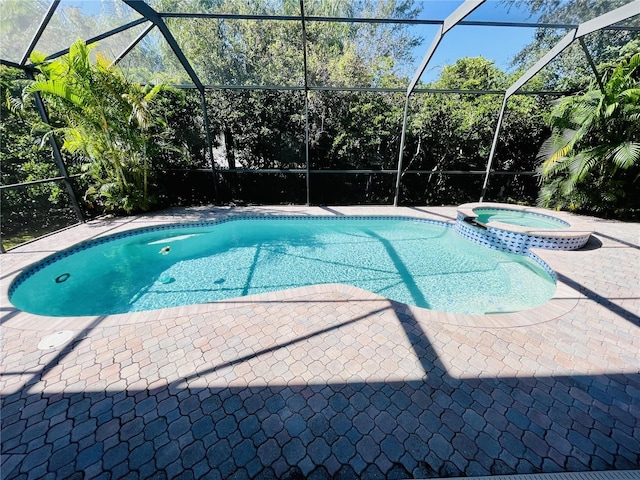 view of pool featuring an in ground hot tub and a patio