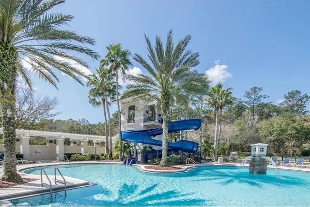 view of swimming pool featuring a water slide