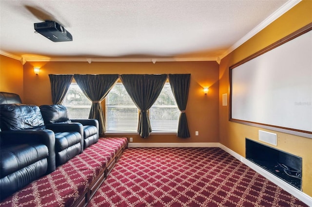 cinema room featuring a textured ceiling, ornamental molding, carpet, and baseboards