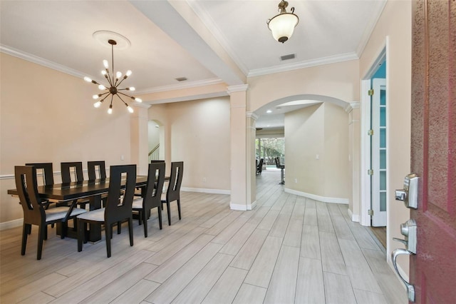 dining area featuring arched walkways, ornamental molding, and wood finish floors