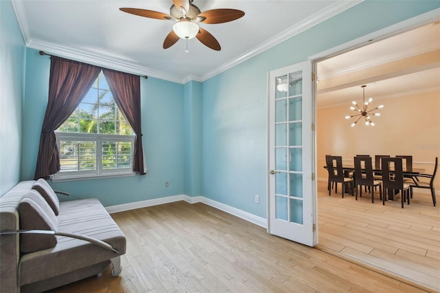 living area featuring baseboards, ornamental molding, french doors, light wood-style floors, and ceiling fan with notable chandelier