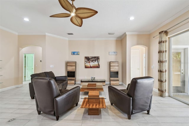 living room with visible vents, arched walkways, and ornamental molding