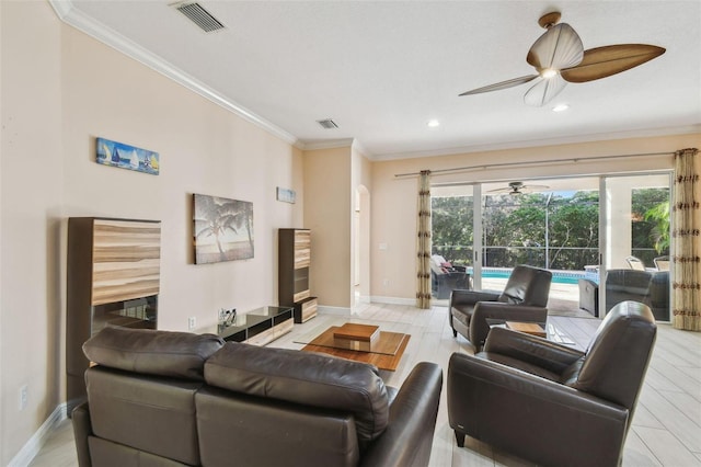 living room with ornamental molding, visible vents, and light wood-style floors