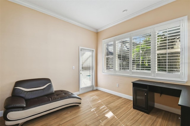 living area with light wood-style floors, baseboards, and crown molding