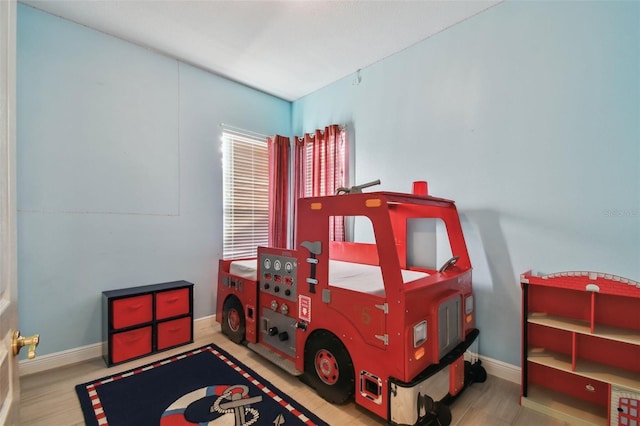 bedroom featuring baseboards