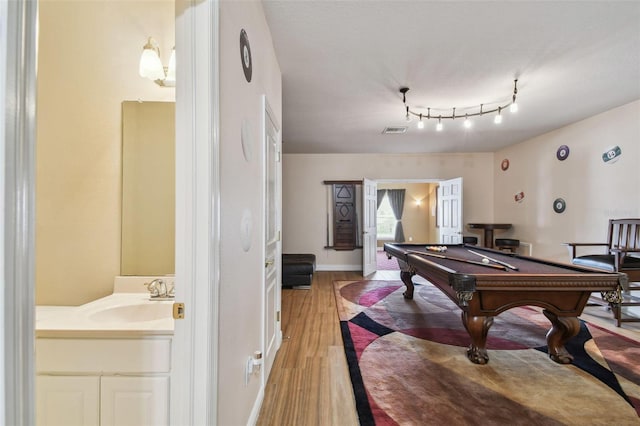 playroom featuring baseboards, visible vents, pool table, light wood-style floors, and a sink