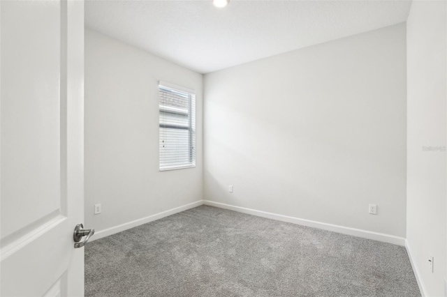 spare room featuring carpet flooring