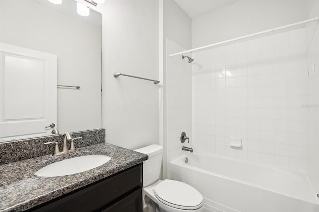 full bathroom featuring vanity, toilet, and tiled shower / bath combo