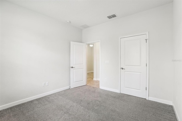 unfurnished bedroom with carpet