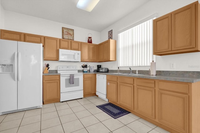 kitchen with white appliances, light tile patterned floors, and sink